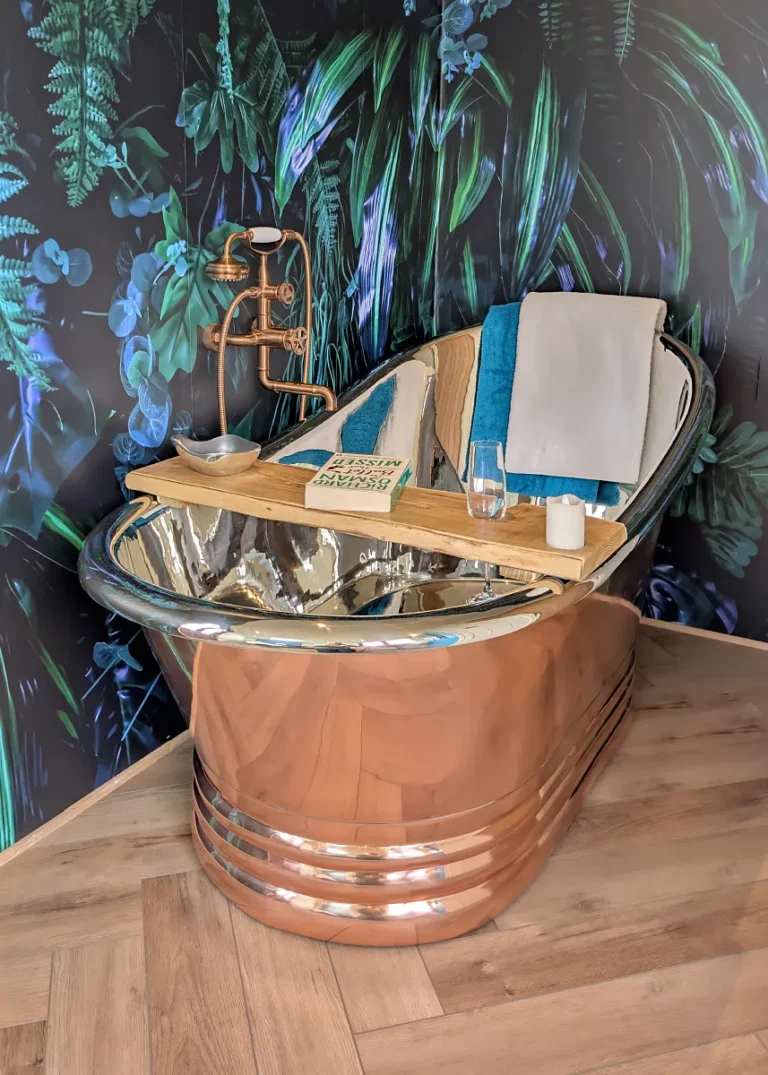 The Grand hut has a copper bath with copper piping and taps by Belringham Shepherd Huts