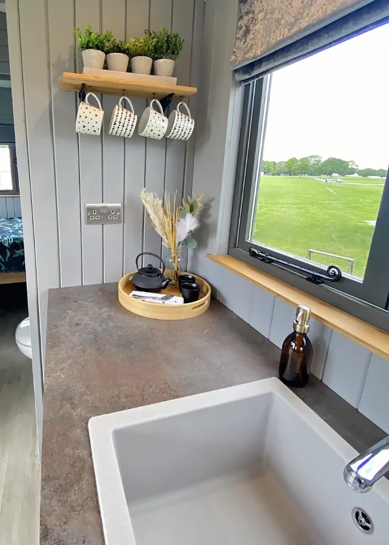 The Haven 2 Kitchenette with light grey sink and metal effect work surface by Belringham Shepherd Huts
